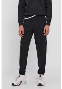 Calvin Klein Jeans Spodnie męskie kolor czarny gładkie. Kolor: czarny. Materiał: dzianina. Wzór: gładki