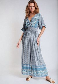 Born2be - Niebieski Bawełniany Kombinezon z Gumkami w Pasie i Kopertowym Dekoltem Zapinany z Tyłu na Guziki Lorrania. Okazja: na co dzień. Kolor: niebieski. Materiał: bawełna. Długość rękawa: krótki rękaw. Długość: krótkie. Styl: elegancki, casual, wizytowy #2