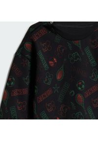 Adidas - Zestaw Disney Mickey Mouse Jogger Kids. Kolor: żółty, wielokolorowy, pomarańczowy, czarny. Wzór: motyw z bajki. Styl: młodzieżowy