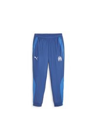 Puma - Tkane spodnie dresowe Prematch om 2023/24. Kolor: niebieski. Materiał: dresówka. Sport: piłka nożna