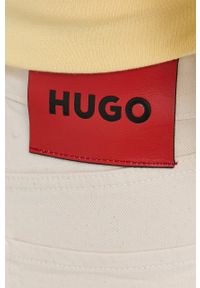 Hugo - HUGO jeansy damskie high waist. Stan: podwyższony. Kolor: beżowy