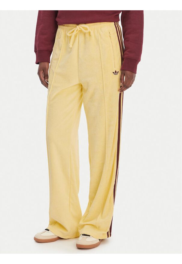 Adidas - adidas Spodnie dresowe Terry Towel Firebird KQ6662 Żółty Loose Fit. Kolor: żółty. Materiał: bawełna