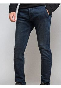Sinsay - Spodnie jeansowe chino slim fit - niebieski. Kolor: niebieski. Materiał: jeans