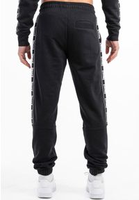 Spodnie dresowe klasyczne Lonsdale Grutness. Kolor: czarny, wielokolorowy, biały. Materiał: dresówka. Długość: długie. Styl: klasyczny #2