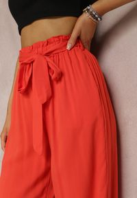 Renee - Ciemnopomarańczowe Spodnie Szerokie Phiorephis. Kolor: pomarańczowy. Materiał: materiał, tkanina, wiskoza. Długość: długie. Wzór: kwiaty, gładki