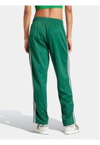 Adidas - adidas Spodnie dresowe adicolor Classics SST IM9818 Zielony Loose Fit. Kolor: zielony. Materiał: bawełna, syntetyk