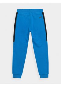 4f - Spodnie dresowe jogggery chłopięce. Okazja: na co dzień. Kolor: niebieski. Materiał: dresówka. Styl: casual #2