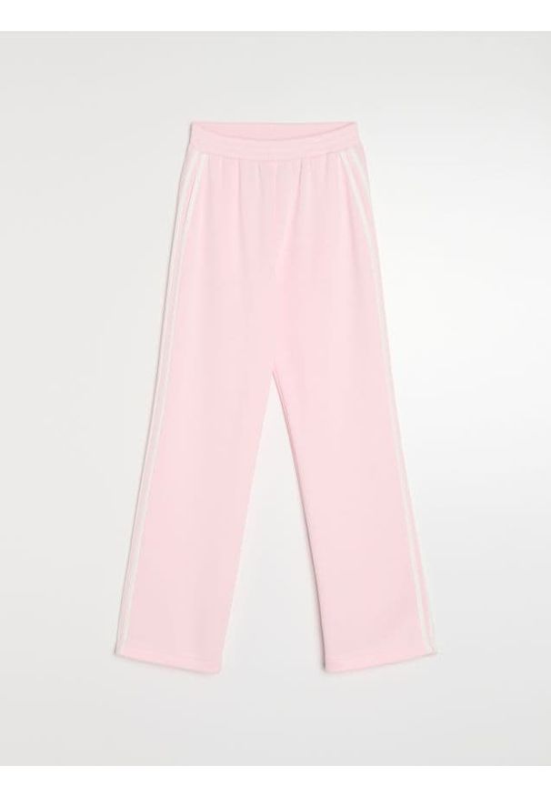 Sinsay - Spodnie carrot z miękkiej dzianiny scuba z lampasem - różowy. Kolor: różowy. Materiał: dzianina