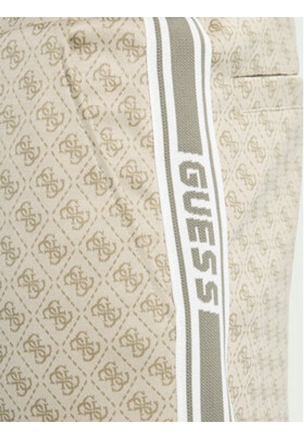 Guess Spodnie dresowe Z5BB19 K2042 Beżowy Regular Fit. Kolor: beżowy. Materiał: syntetyk