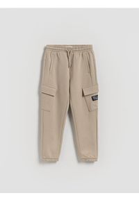 Reserved - Spodnie jogger cargo - beżowy. Kolor: beżowy. Materiał: bawełna, dzianina