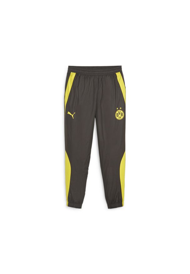 Puma - Spodnie dresowe Prematch Borussia Dortmund Woven 2023/24. Kolor: żółty, czarny, pomarańczowy, wielokolorowy. Materiał: dresówka. Sport: piłka nożna