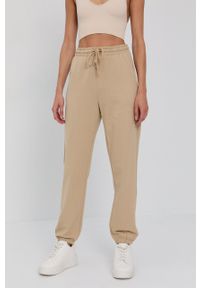 Vero Moda Spodnie damskie kolor beżowy gładkie. Kolor: beżowy. Materiał: dzianina, materiał, bawełna. Wzór: gładki