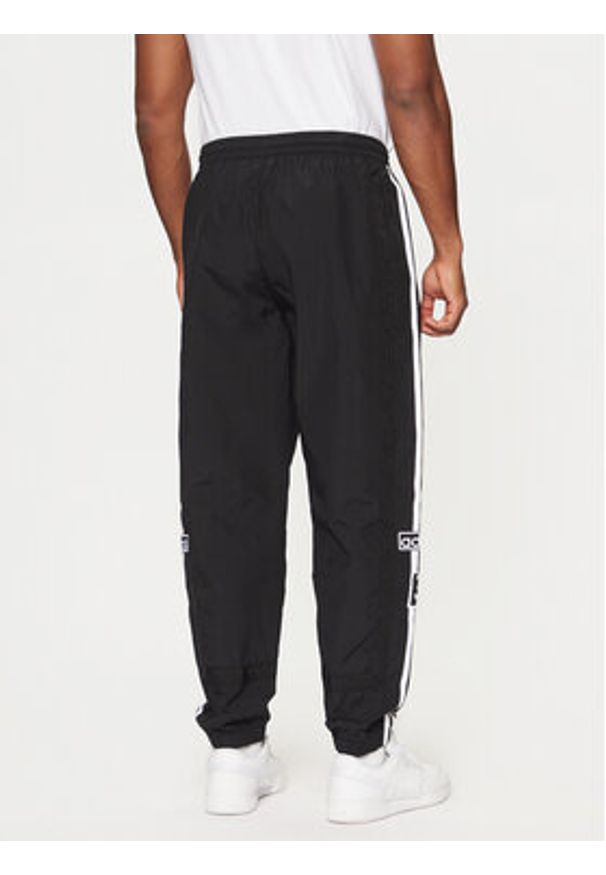Adidas - adidas Spodnie dresowe Adibreak JD4257 Czarny Loose Fit. Kolor: czarny. Materiał: syntetyk