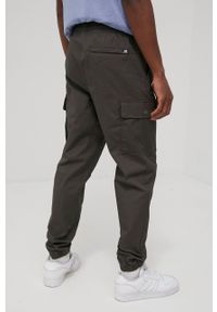 New Balance spodnie MP13501COG męskie kolor zielony gładkie. Kolor: zielony. Materiał: bawełna. Wzór: gładki #3
