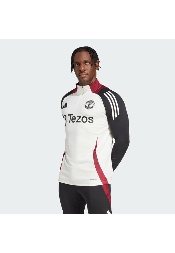 Adidas - Bluza Manchester United Tiro 24 Training. Kolor: czarny, biały, wielokolorowy. Materiał: dresówka, materiał. Sport: piłka nożna