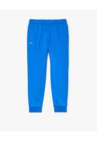 Lacoste - LACOSTE - Niebieskie spodnie dresowe Sport Tennis. Kolor: niebieski. Materiał: dresówka. Wzór: haft. Sport: kolarstwo, fitness #2