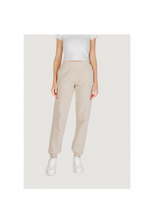 Guess Active - Spodnie Kobieta GUESS ACTIVE PRIMULA RHINESTONES JOGGER. Kolor: beżowy. Długość: długie