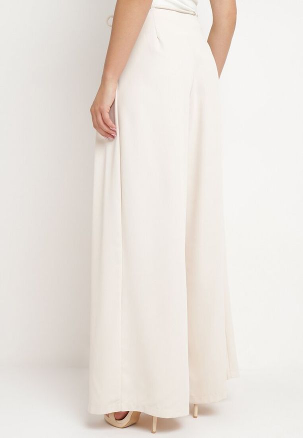 Born2be - Jasnobeżowe Spodnie z Wysokim Stanem i Szerokimi Nogawkami Wiązane w Pasie Vikonni. Okazja: na co dzień, na spotkanie biznesowe, do pracy. Stan: podwyższony. Kolor: beżowy. Styl: biznesowy, casual, elegancki, klasyczny