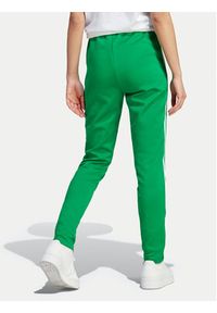 Adidas - adidas Spodnie dresowe adicolor SST IK6601 Zielony Slim Fit. Kolor: zielony. Materiał: syntetyk #3