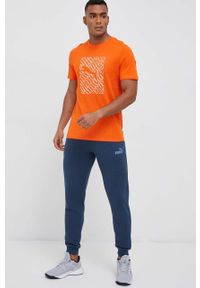 Puma spodnie dresowe kolor granatowy gładkie. Kolor: niebieski. Materiał: dresówka. Wzór: gładki #4