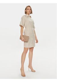 Calvin Klein Sukienka koszulowa K20K206697 Beżowy Relaxed Fit. Kolor: beżowy. Materiał: lyocell. Typ sukienki: koszulowe #4