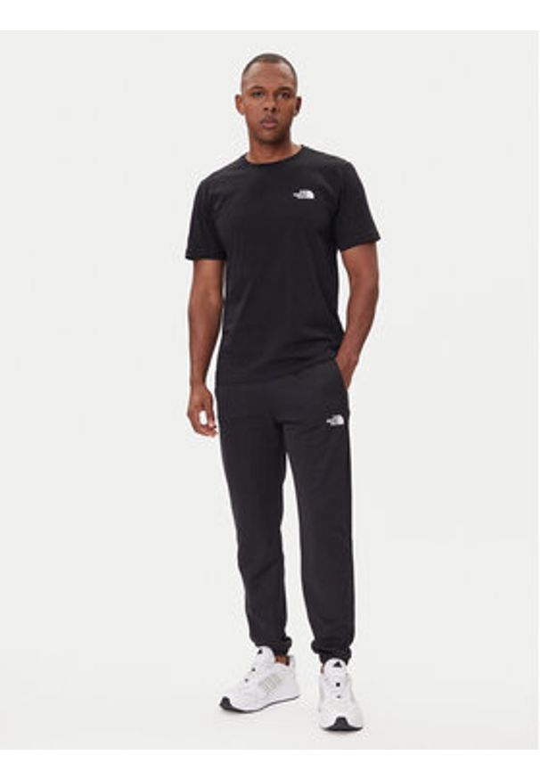 The North Face Spodnie dresowe Reaxion 2.0 NF0A8DRS Czarny Regular Fit. Kolor: czarny. Materiał: syntetyk