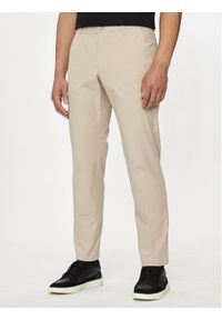 Guess Spodnie materiałowe M4YB01 WG9Z2 Beżowy Slim Fit. Kolor: beżowy. Materiał: syntetyk