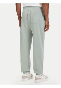 TOMMY HILFIGER - Tommy Hilfiger Spodnie dresowe Essential UM0UM03911 Zielony jasny Relaxed Fit. Kolor: zielony. Materiał: bawełna #3