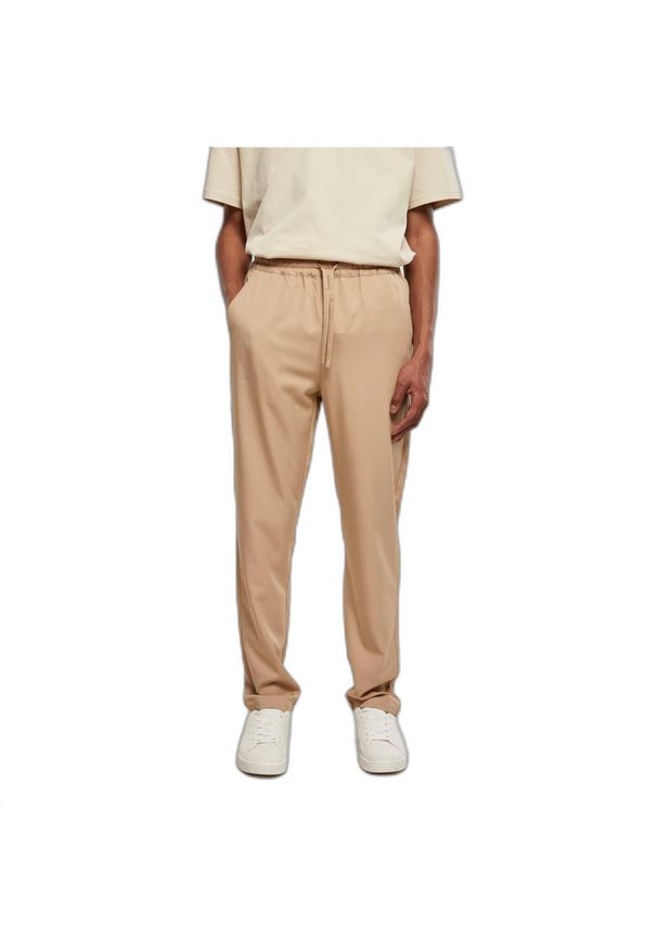 Spodnie dresowe Urban Classics Tapered. Kolor: beżowy. Materiał: dresówka