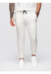 Ombre Clothing - Dresowe spodnie męskie ze ściągaczami w nogawkach i gumowym nadrukiem – białe V2 - Rozmiar: M. Kolor: biały. Materiał: guma, dresówka. Wzór: nadruk. Styl: elegancki, sportowy