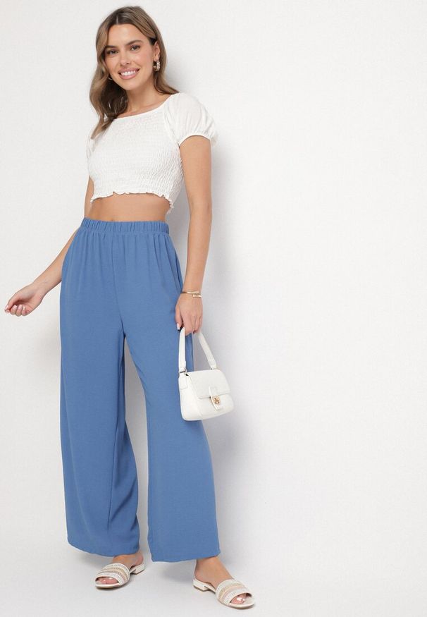 Born2be - Niebieskie Spodnie Palazzo o Szerokim Kroju z Wysokim Stanem Aravenna. Okazja: na co dzień. Stan: podwyższony. Kolor: niebieski. Wzór: aplikacja. Styl: casual, elegancki