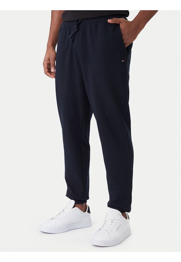 TOMMY HILFIGER - Tommy Hilfiger Spodnie dresowe Essential MW0MW37236 Granatowy Regular Fit. Kolor: niebieski. Materiał: bawełna