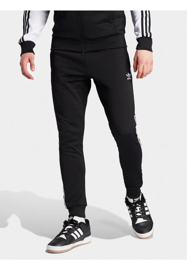 Adidas - adidas Spodnie dresowe adicolor Classics SST IL2488 Czarny Slim Fit. Kolor: czarny. Materiał: bawełna