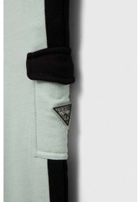 Guess spodnie dresowe bawełniane dziecięce kolor turkusowy wzorzyste. Stan: podwyższony. Kolor: turkusowy. Materiał: bawełna, dresówka #3