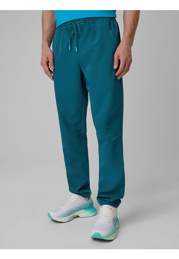 4f - 4F Spodnie treningowe szybkoschnące męskie - granatowe S. Kolor: niebieski. Materiał: skóra. Sport: fitness