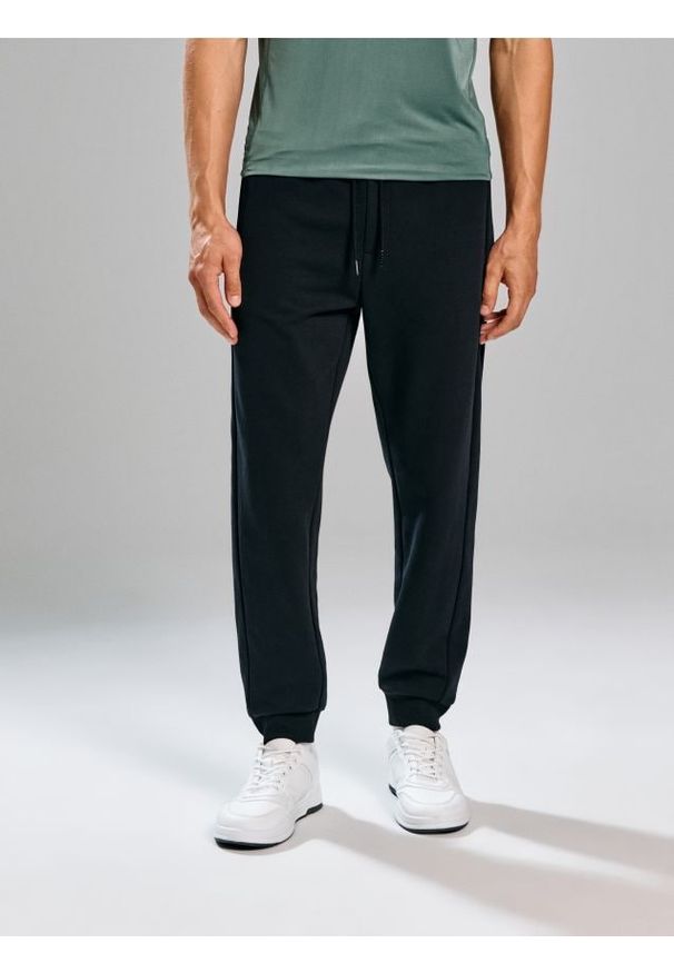Sinsay - Spodnie regular fit SNSY PERFORMANCE - czarny. Kolor: czarny