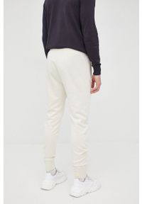 Tom Tailor spodnie męskie kolor beżowy. Kolor: beżowy. Materiał: dzianina, materiał, włókno