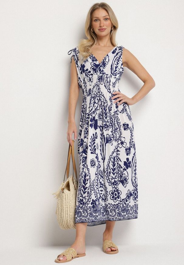 Born2be - Niebieska Sukienka z Roślinnym Wzorem i Kopertowym Dekoltem z Gumką w Talii Orrune. Okazja: do pracy, na co dzień, na spotkanie biznesowe. Typ kołnierza: dekolt kopertowy. Kolor: niebieski. Materiał: jeans. Sezon: lato. Typ sukienki: kopertowe. Styl: casual, klasyczny, biznesowy