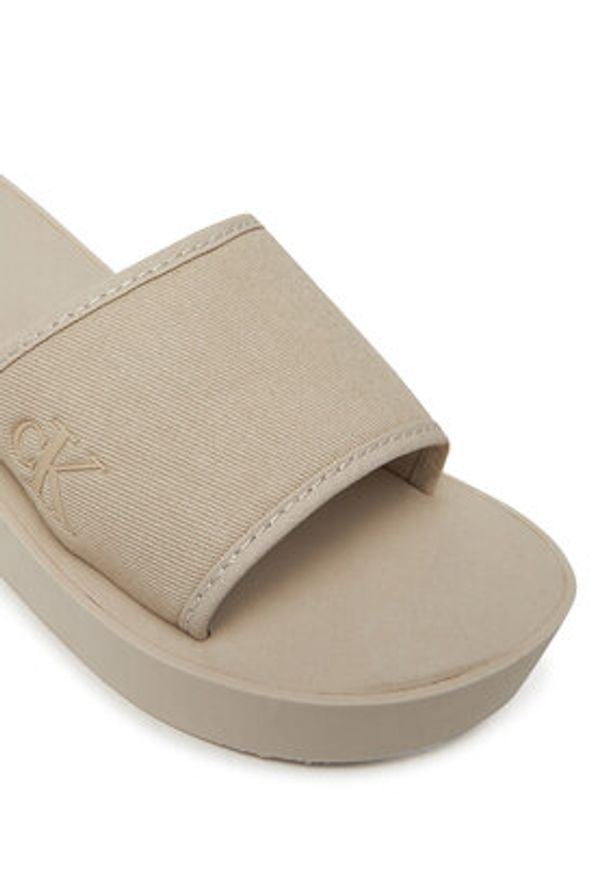Calvin Klein Jeans Klapki Beach Wedge Slide Canvas YW0YW01725 Beżowy. Kolor: beżowy. Materiał: materiał