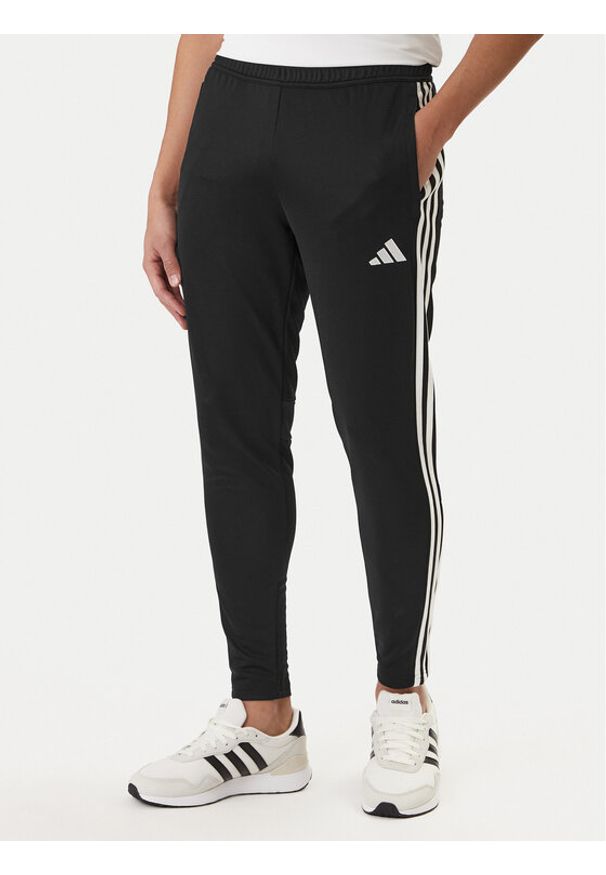 Adidas - adidas Spodnie dresowe Tiro 25 Essentials Training JD0442 Czarny Regular Fit. Kolor: czarny. Materiał: syntetyk