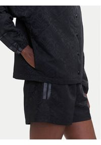 Adidas - adidas Kurtka przejściowa Tiro x Common Goal Coaches JL7647 Czarny Loose Fit. Kolor: czarny. Materiał: syntetyk