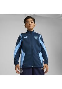 Puma - Młodzieżowa kurtka Manchester City ftblNRGY+ PUMA Marine Blue Blazing. Kolor: niebieski. Wzór: aplikacja. Sport: piłka nożna
