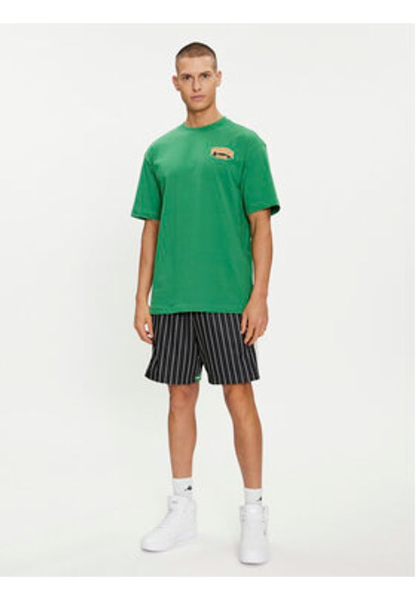 Puma T-Shirt For The Fanbase Graphic 624395 Zielony Relaxed Fit. Kolor: zielony. Materiał: bawełna