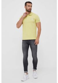 Calvin Klein Jeans polo męski kolor żółty z nadrukiem. Typ kołnierza: polo. Kolor: żółty. Materiał: dzianina. Długość: krótkie. Wzór: nadruk #3
