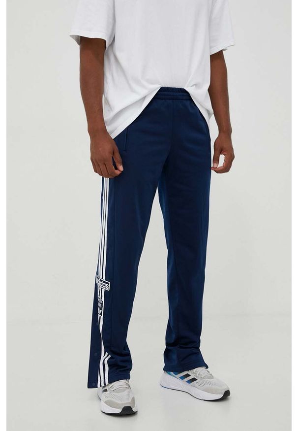adidas Originals spodnie dresowe kolor granatowy z aplikacją. Kolor: niebieski. Materiał: dresówka. Wzór: aplikacja