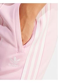 Adidas - adidas Spodnie dresowe adicolor SST IR8076 Różowy Slim Fit. Kolor: różowy. Materiał: bawełna #5
