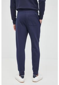 Michael Kors spodnie CR150KR4NF męskie kolor granatowy gładkie. Kolor: niebieski. Materiał: dzianina. Wzór: gładki #2