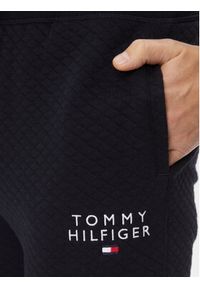 TOMMY HILFIGER - Tommy Hilfiger Spodnie dresowe UM0UM02983 Granatowy Regular Fit. Kolor: niebieski. Materiał: bawełna, syntetyk
