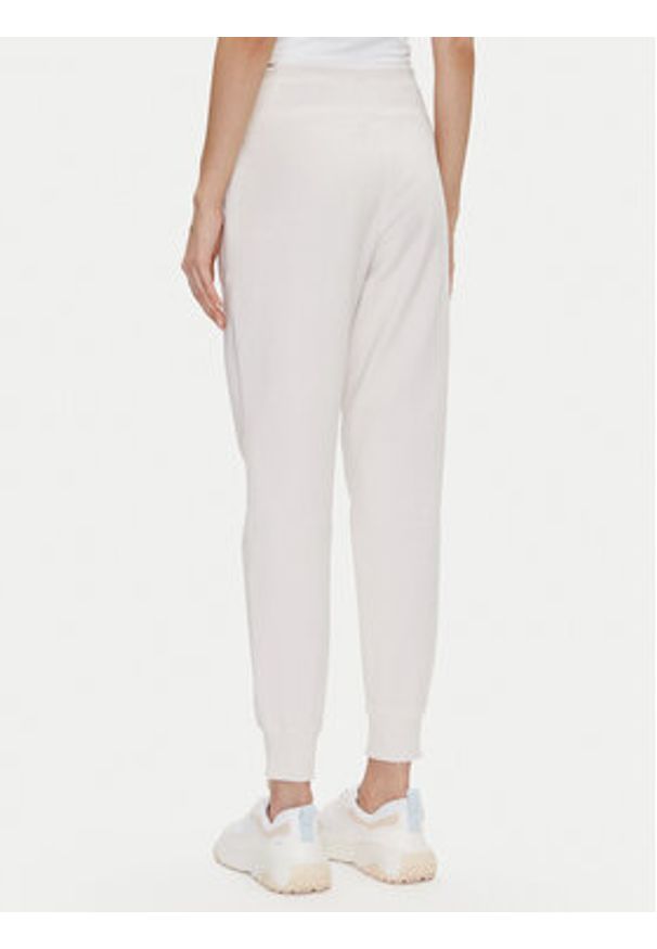 DKNY Sport Spodnie dresowe DP5P3496 Beżowy Regular Fit. Kolor: beżowy. Materiał: bawełna