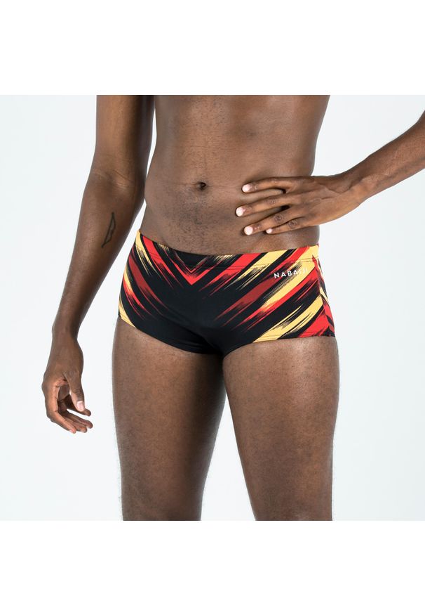 Decathlon - Slipki-opaska pływackie męskie Nabaiji 900 Blast. Kolor: czarny, wielokolorowy, pomarańczowy. Materiał: poliester, poliamid, materiał